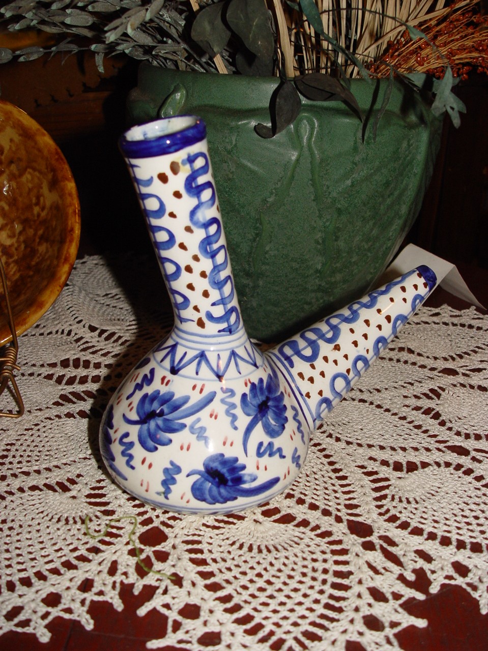 A Blue and
                                        White Kendi Styled Pottery
                                        Pouring Vessel