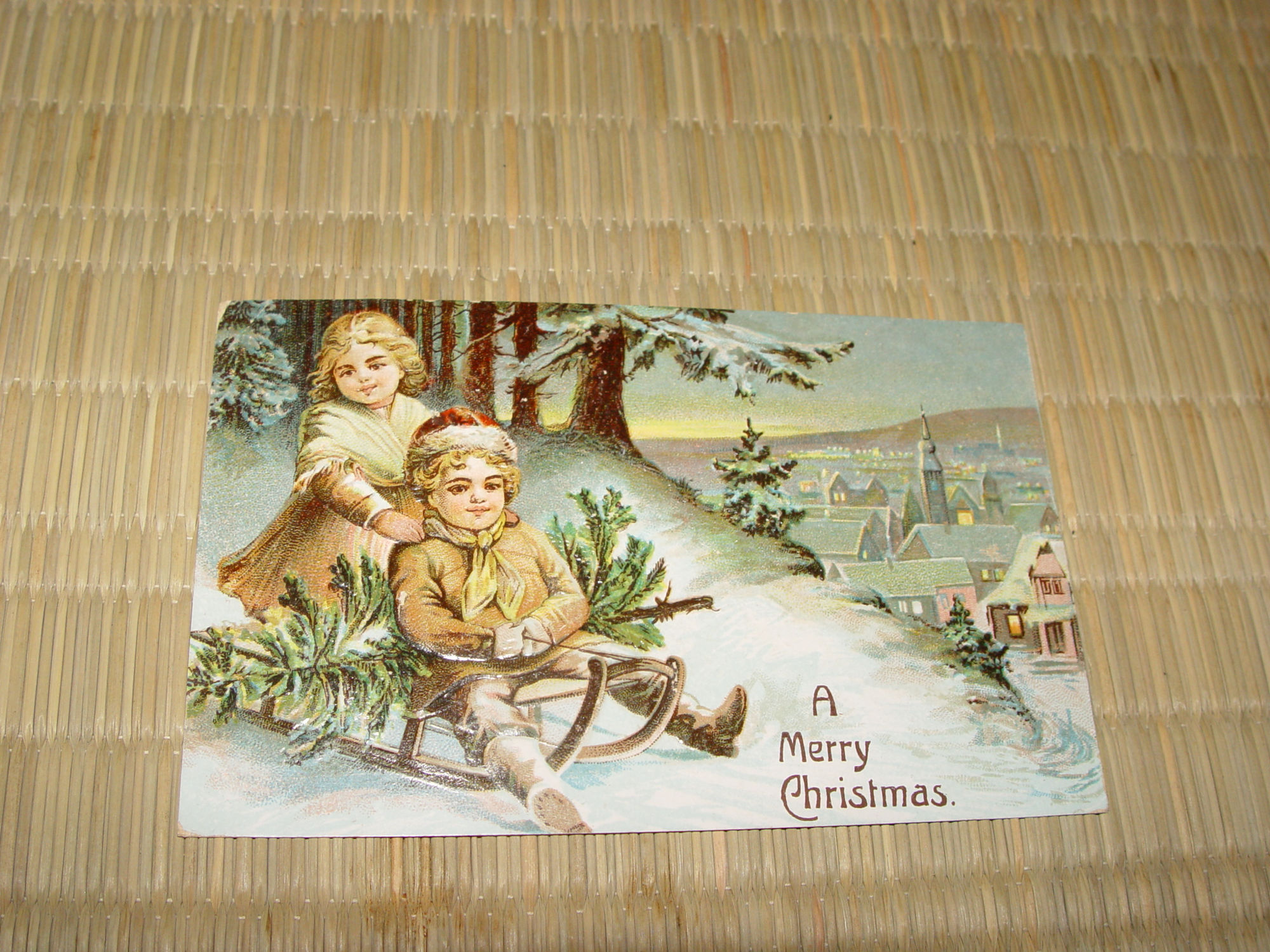 1908 German
                                                Victorian Christmas
                                                Postcard, Children on
                                                Sleigh w/ tree