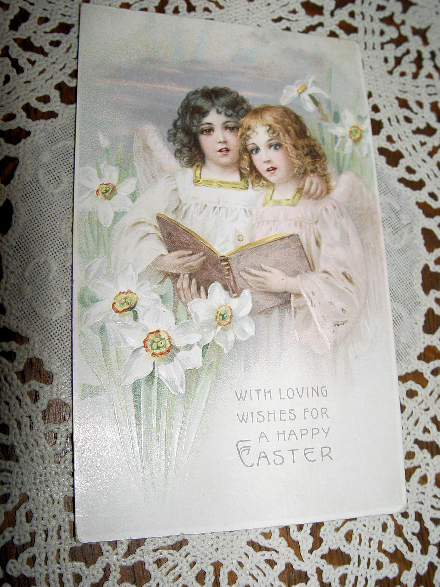 1908 Antique
                                                Easter Postcard, Angel
                                                girls singing 'With
                                                loving wishes' White
                                                Lilies