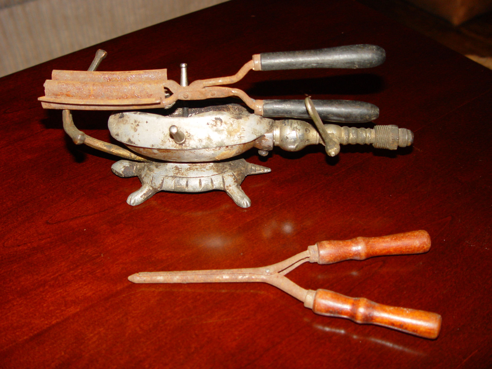 Nickle Plated Gas Heating
                                        Figural Turtle & Two
                                        Victorian Curling Irons