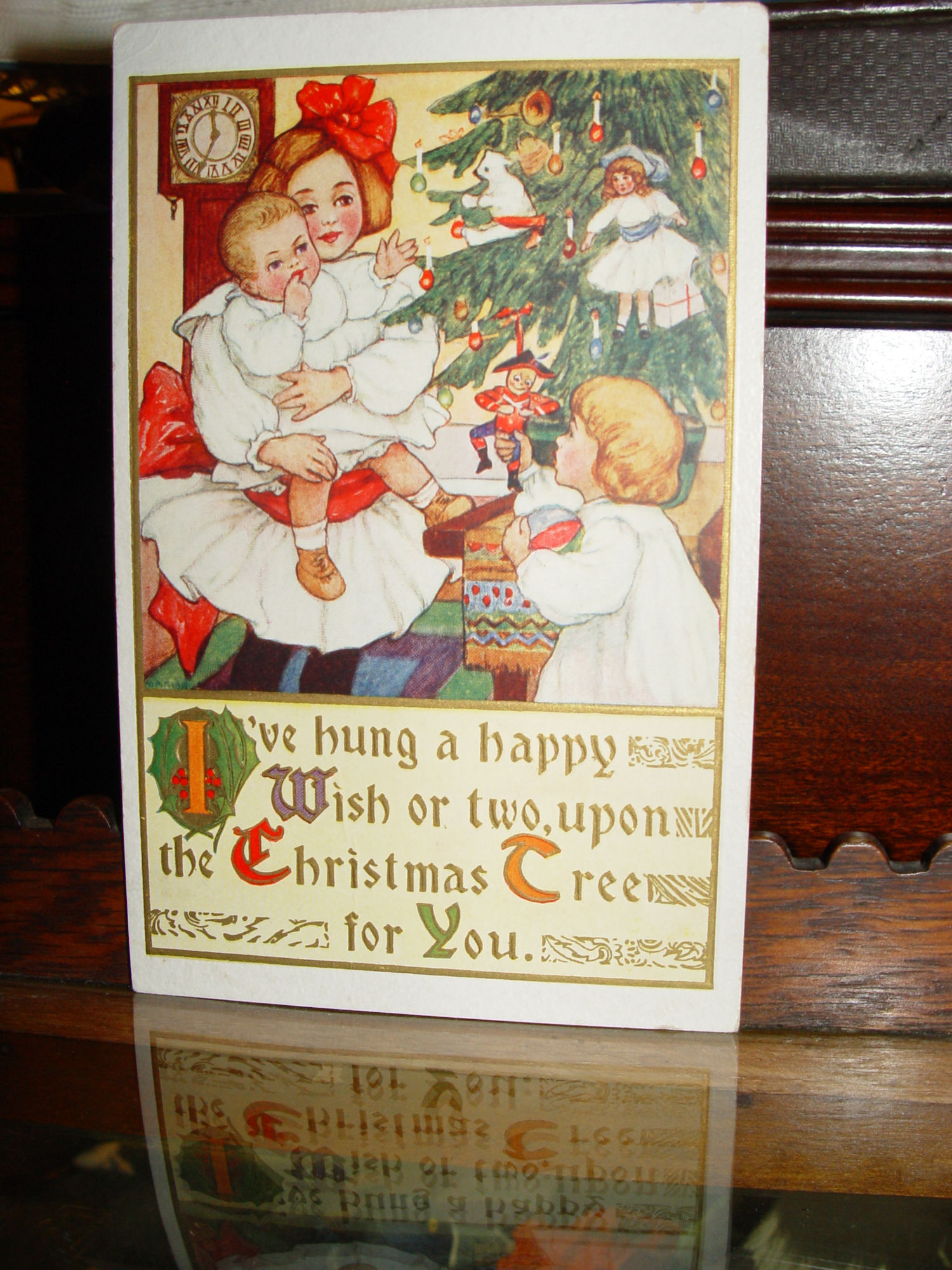 1911 Christmas
                                                Post Card-Girl with
                                                Siblings - Marion
                                                Miller
