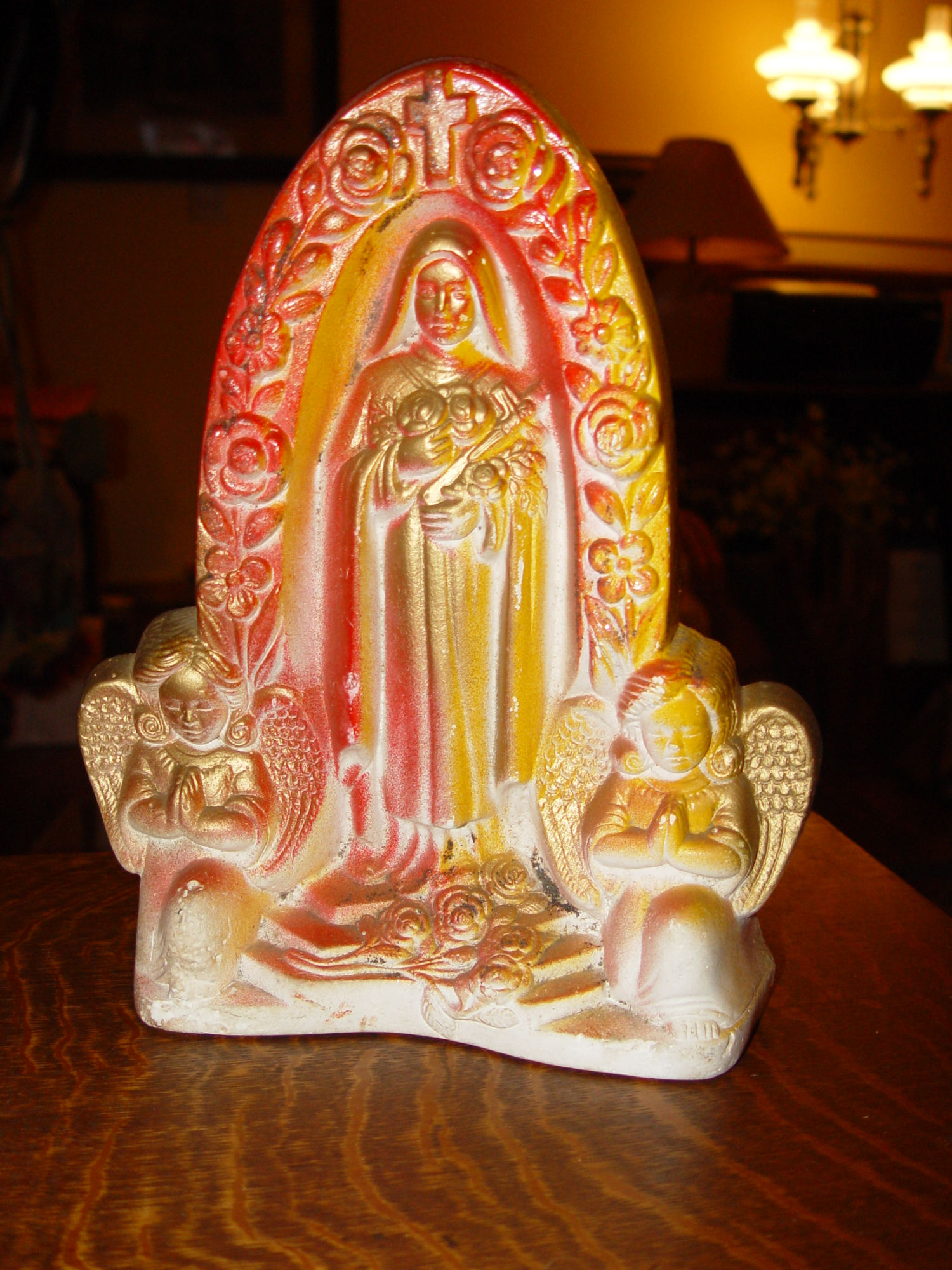 Saint Theresa
                        of Lisieux Chalkware Religious Icon Floral Arch