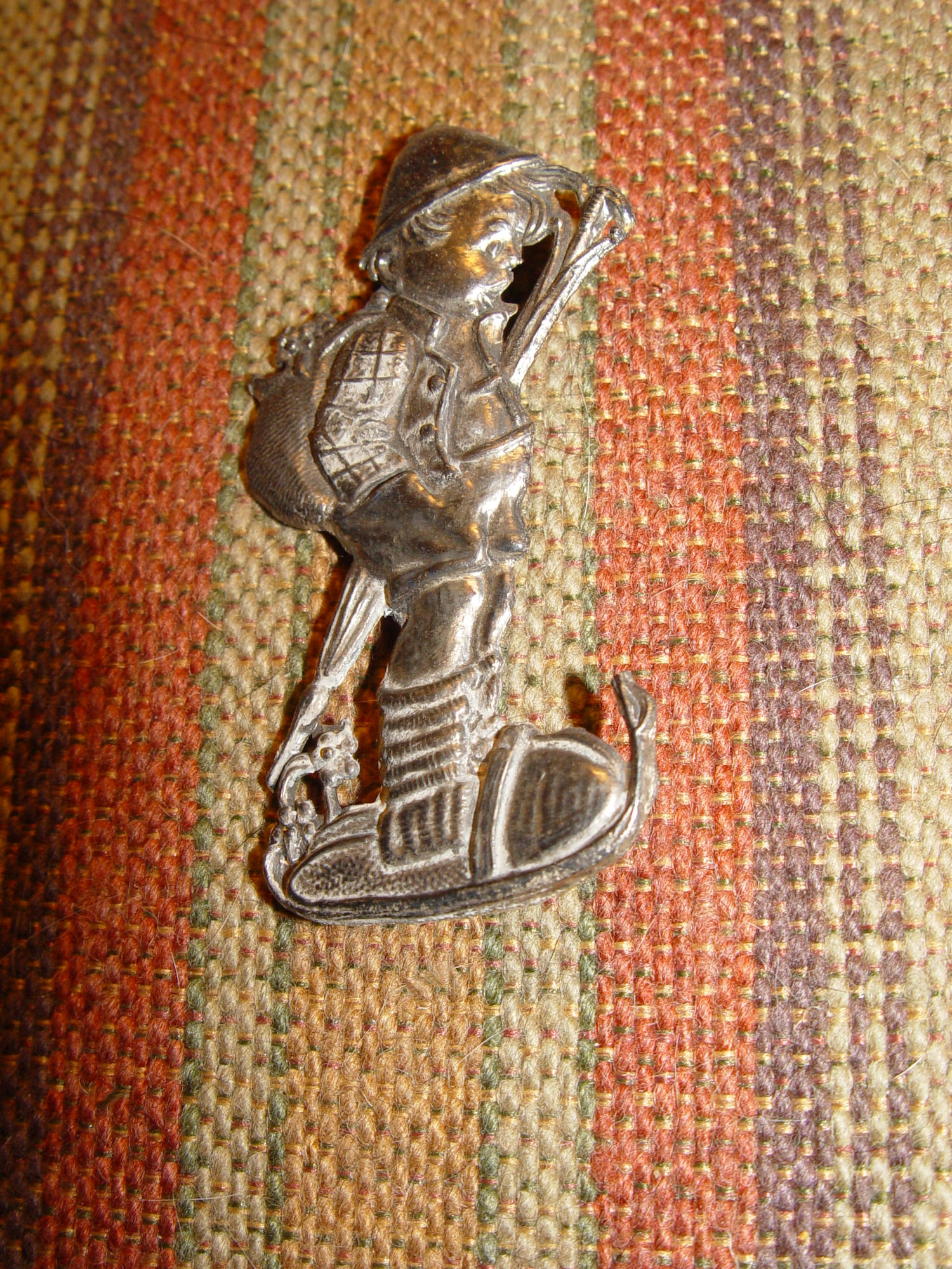 Hummel figure
                        of a boy with umbrella - Pewter brooch 1940s
                        era