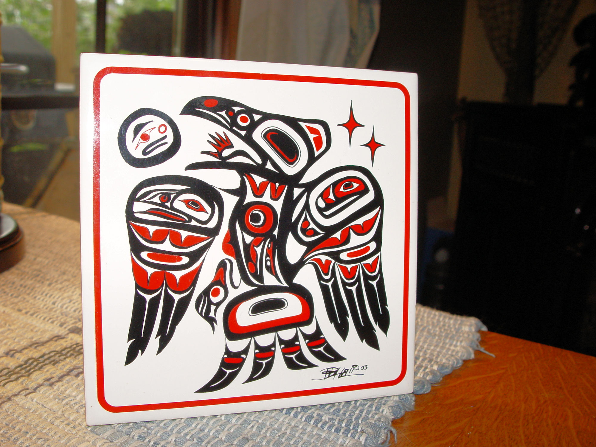 Indigenous
                        Ceramic Art Tile 'Raven' by Tsimshian Artist
                        Bill Helin 2003